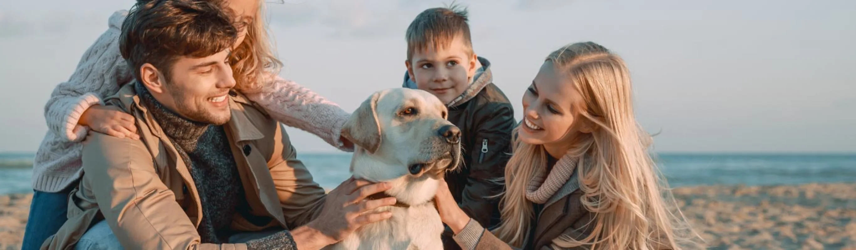 Family on Beach with Dog